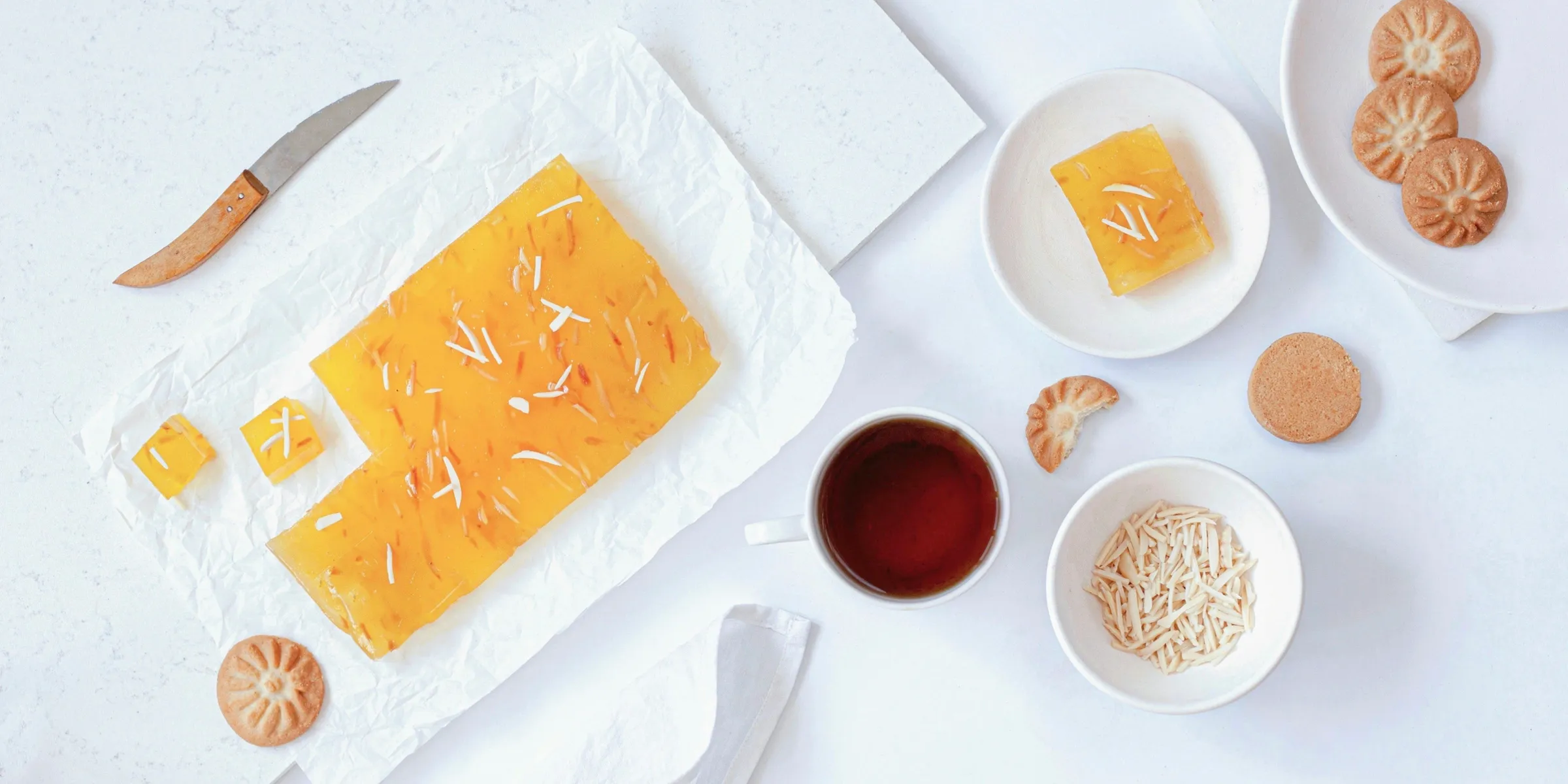 a table topped with plates and bowls of food