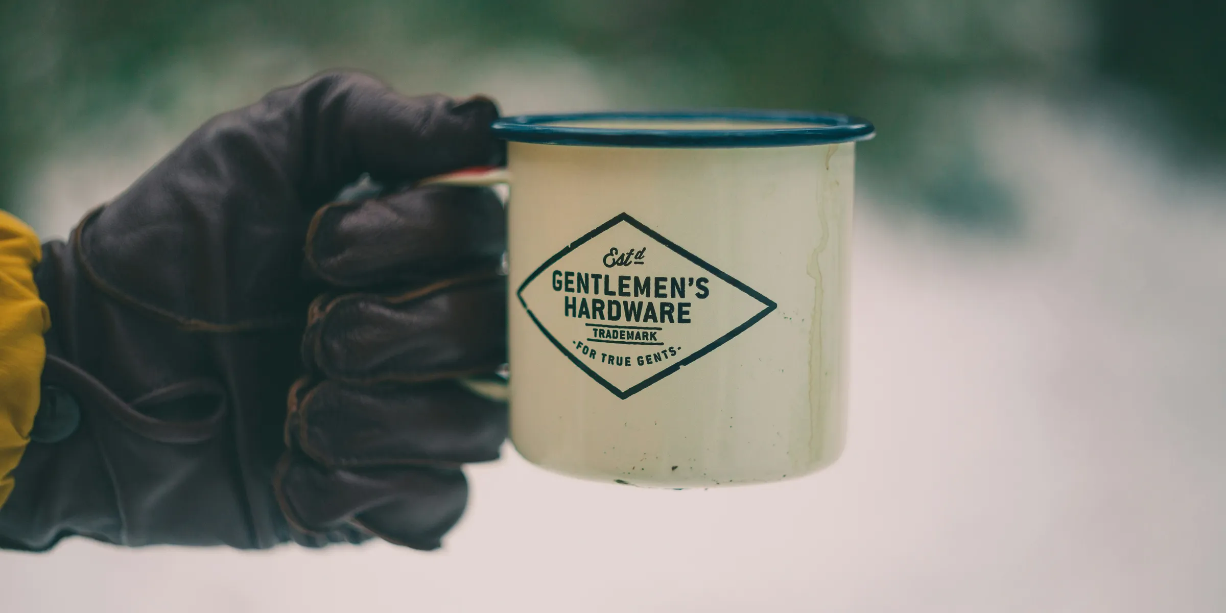 person holding white ceramic mug