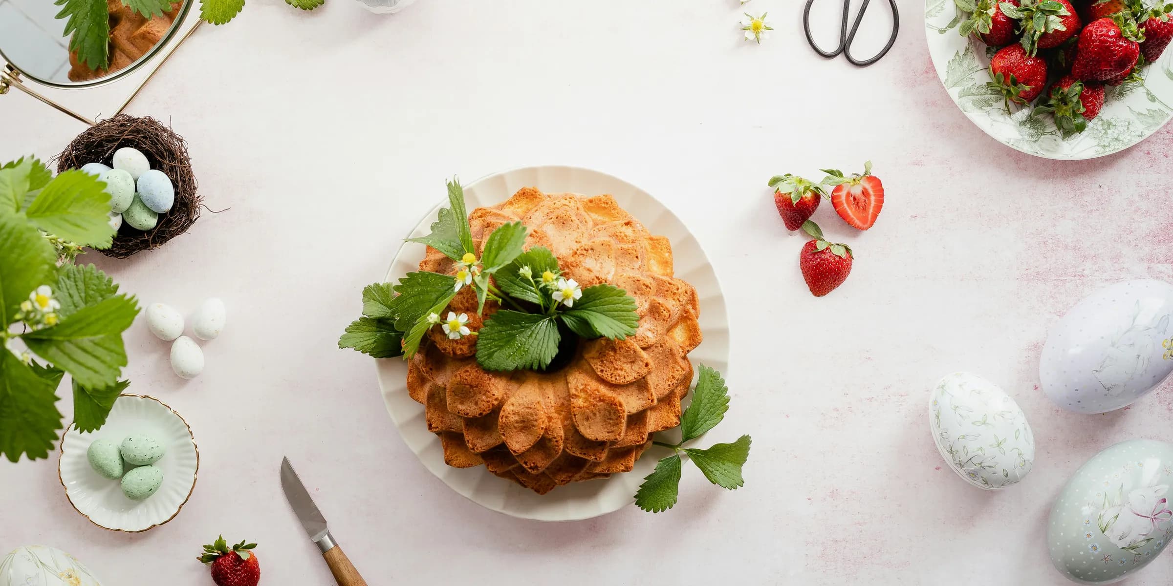a table topped with plates of food and utensils