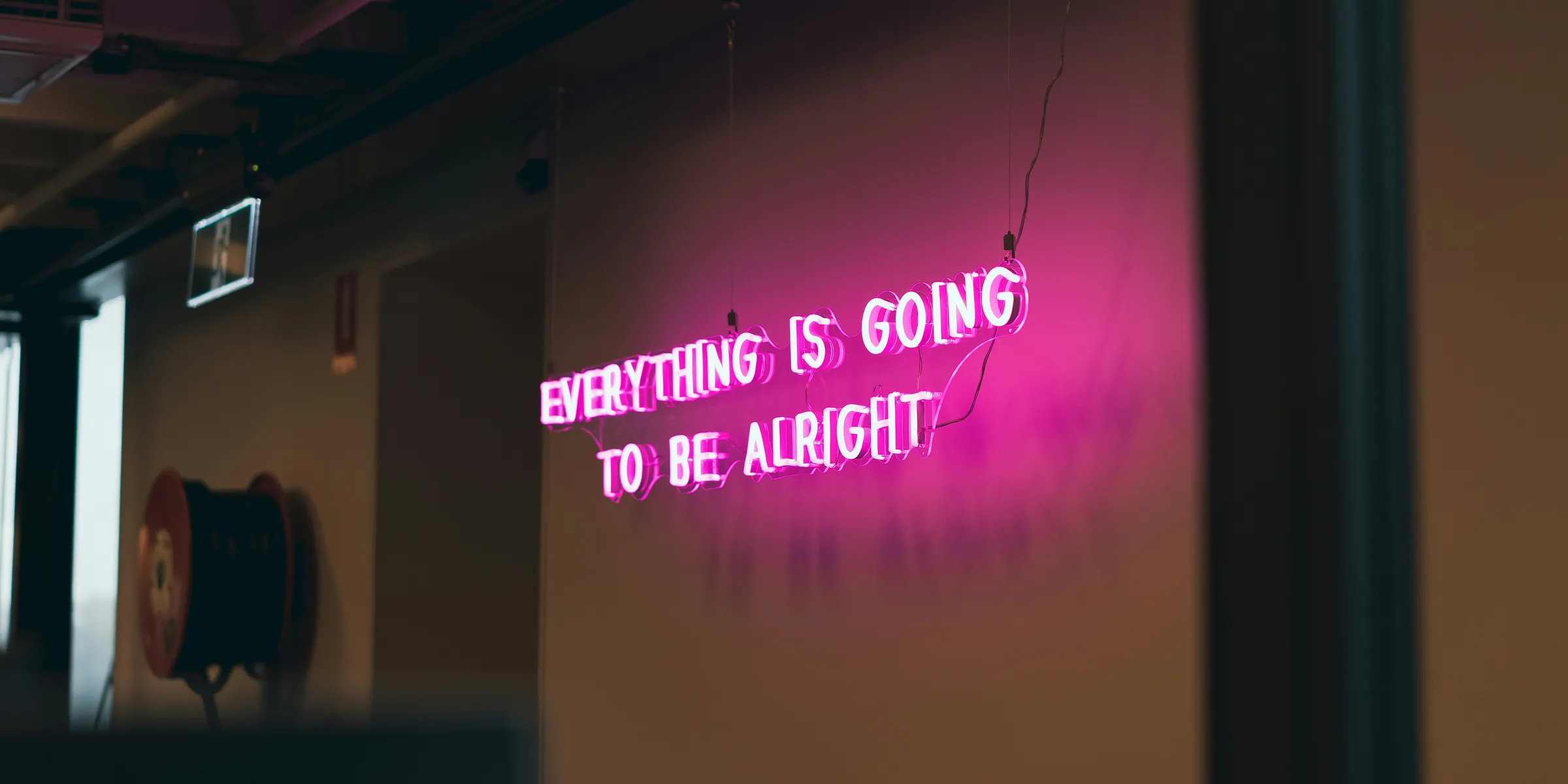 a neon sign that reads everything is going to be alright