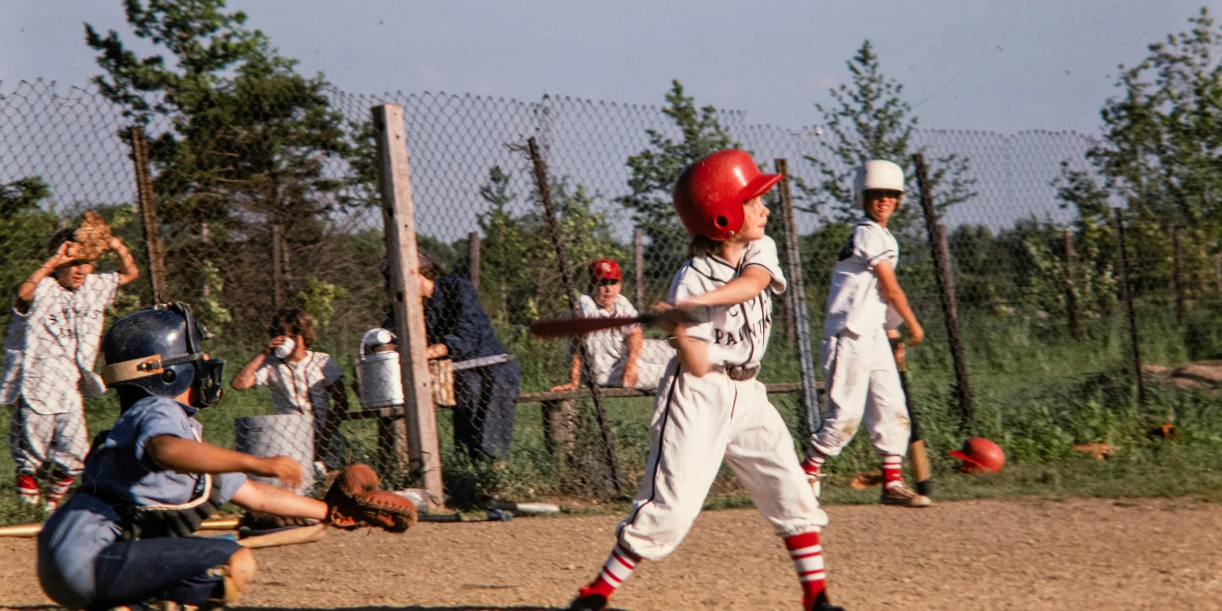 a group of young boys playing a game of baseball
