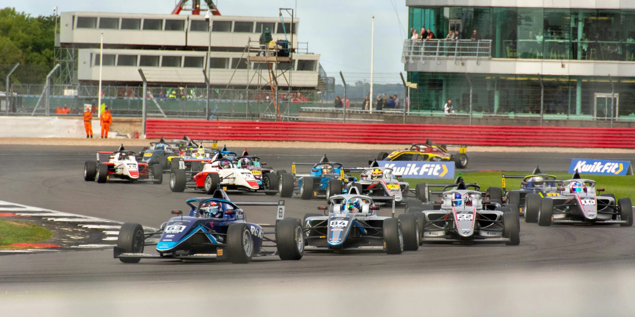 a group of race cars on a track