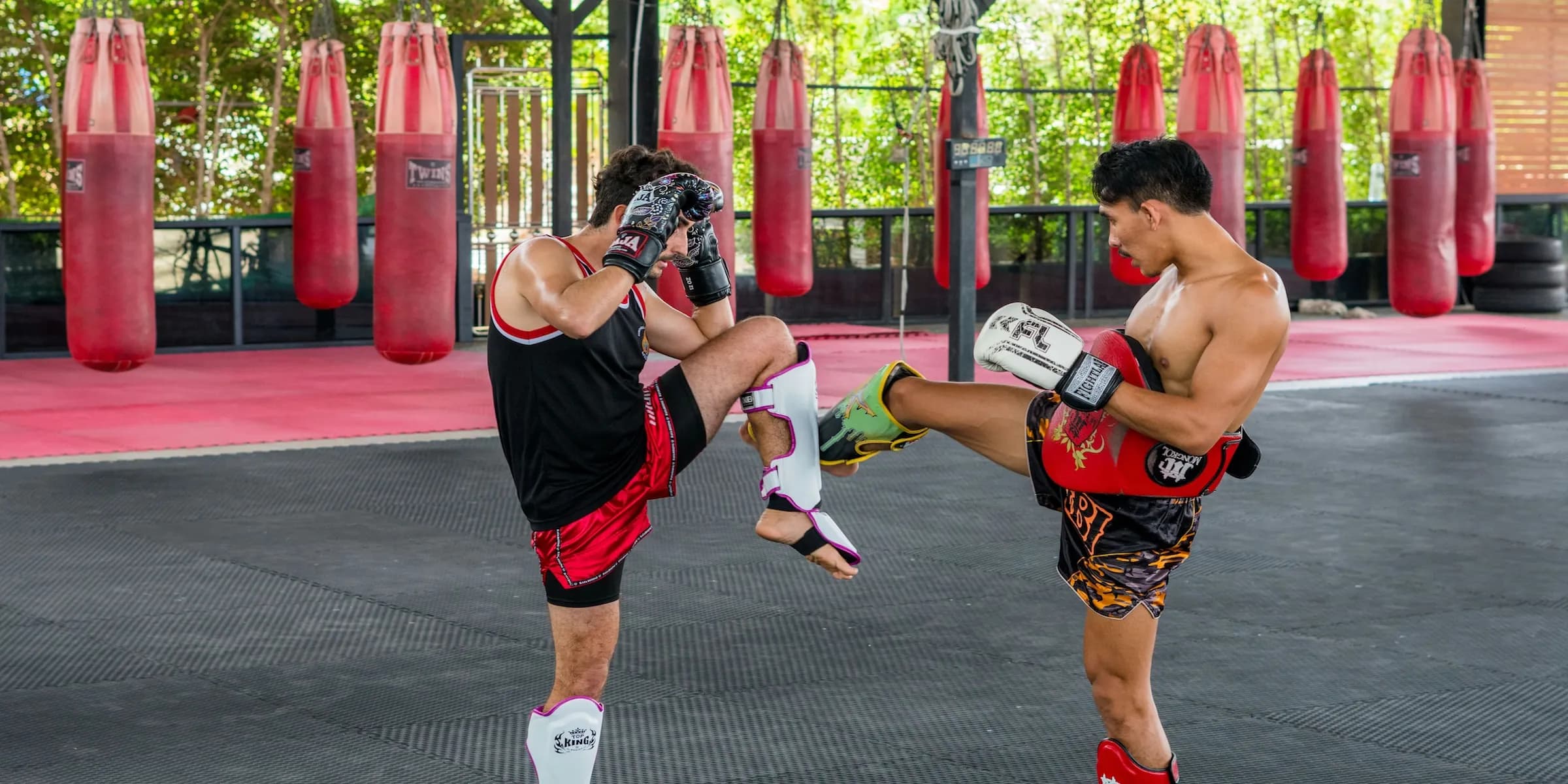 Muay Thai boxer kick opponent