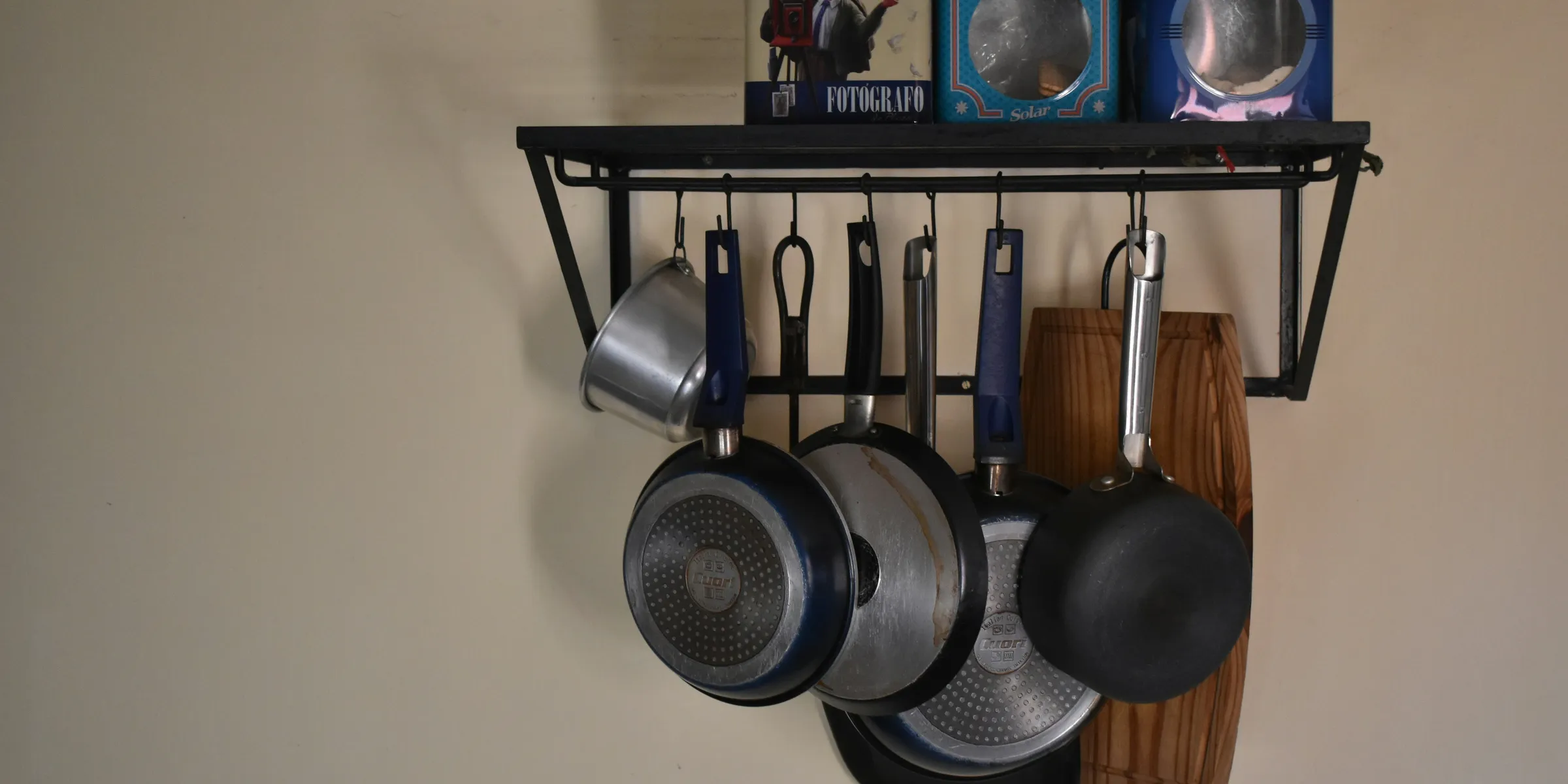 a shelf with pans and pans on it