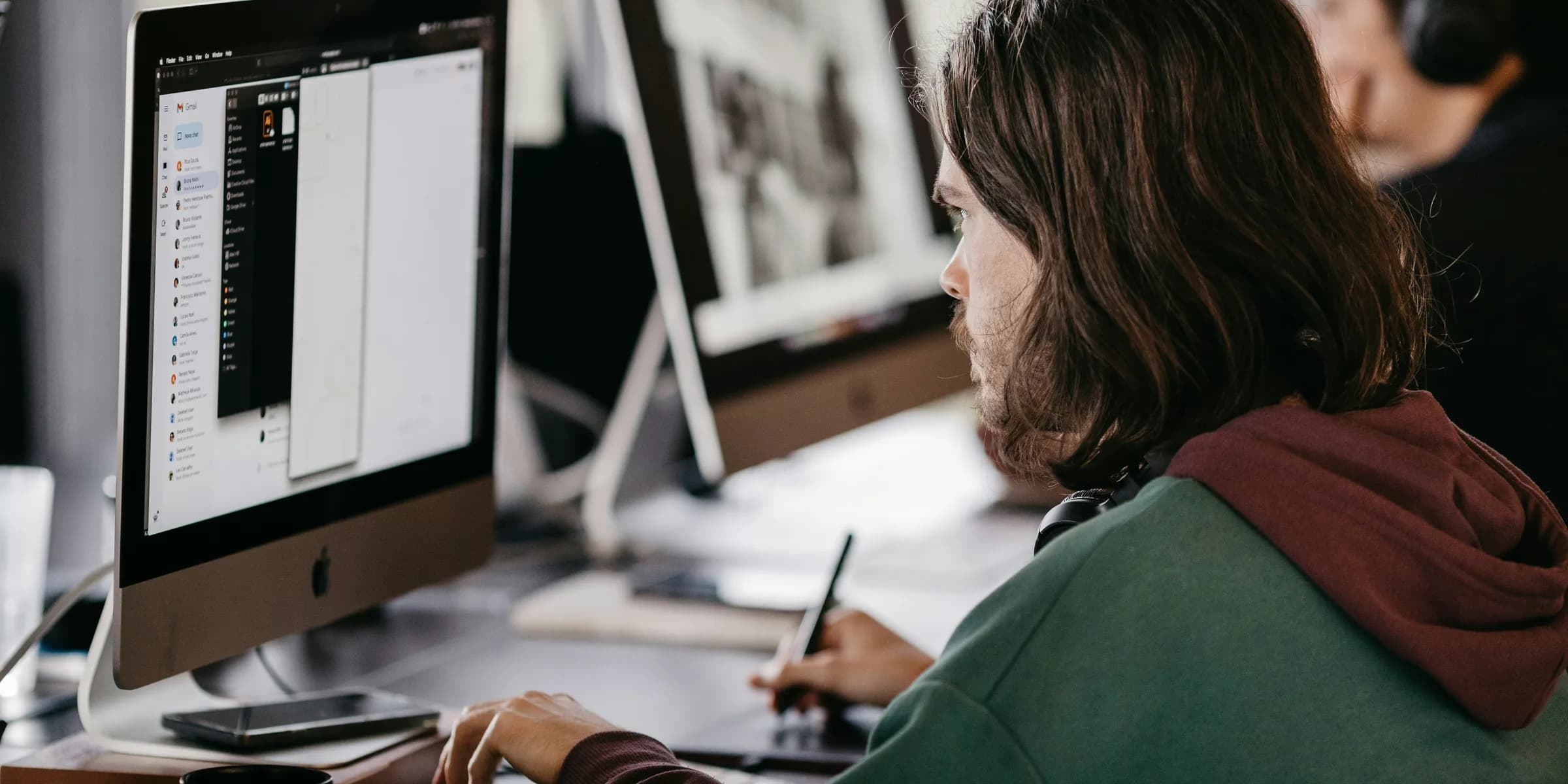 a man and woman looking at a computer screen