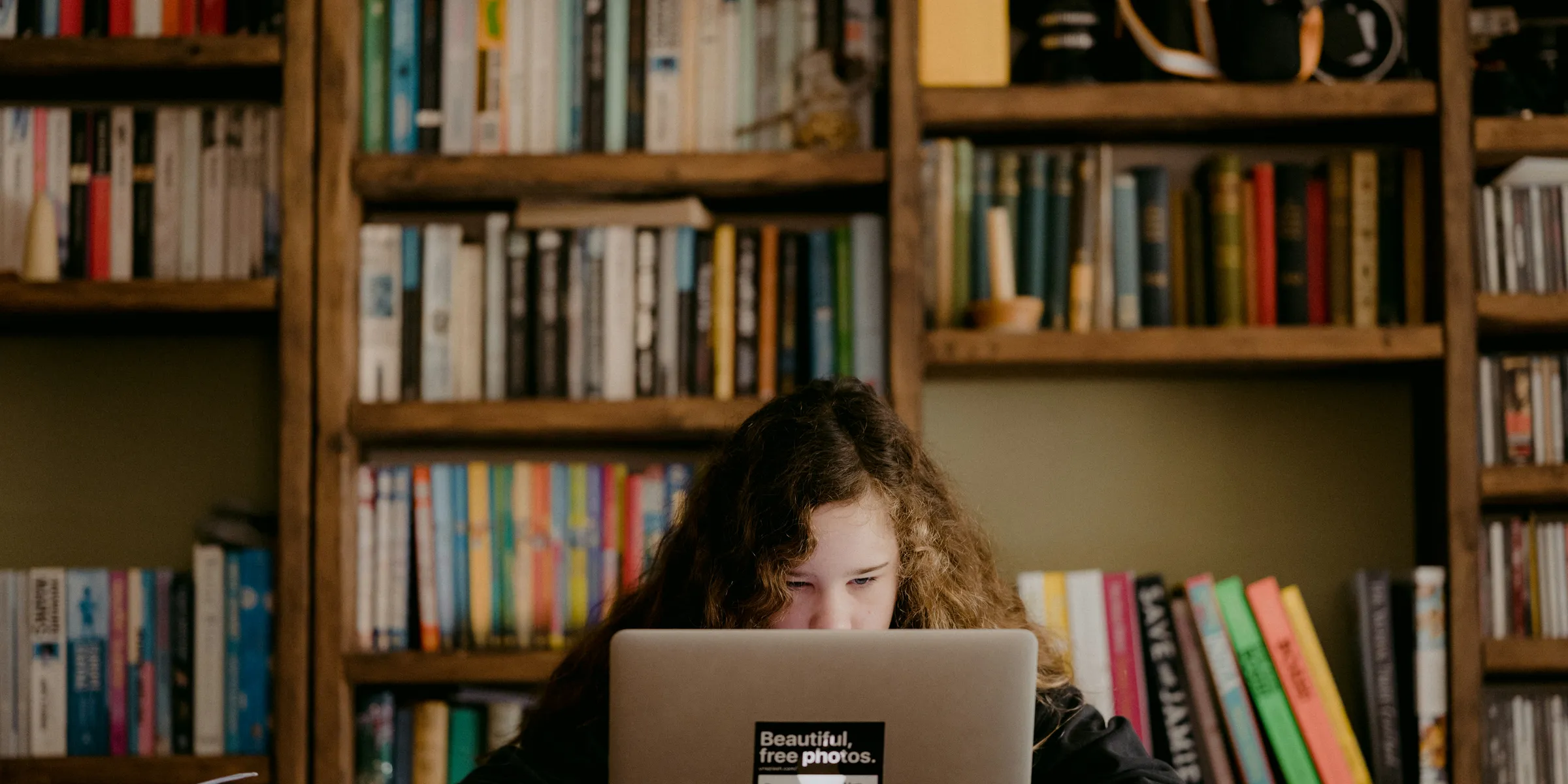 woman in black long sleeve shirt using macbook