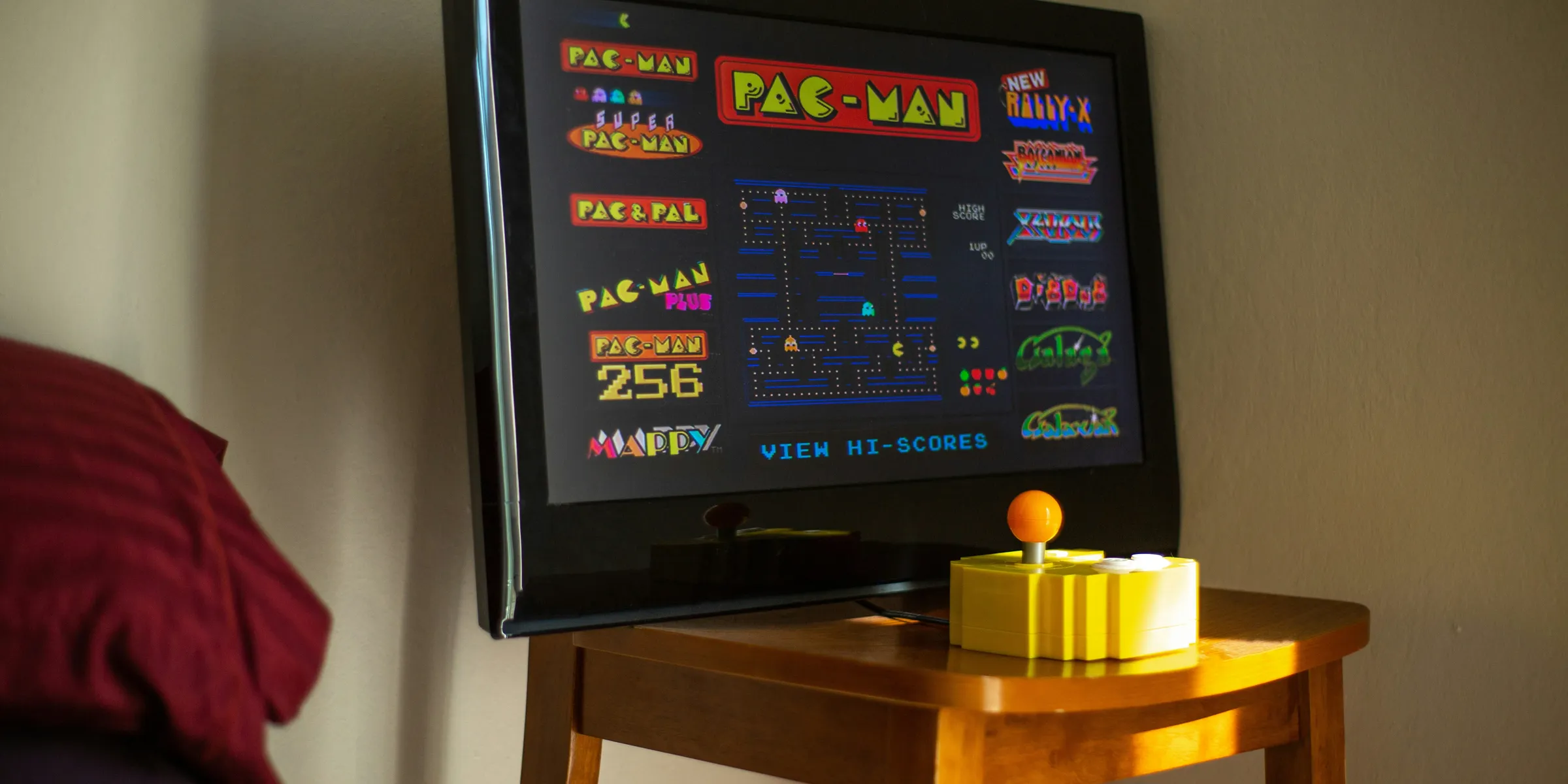 black flat screen tv on brown wooden table
