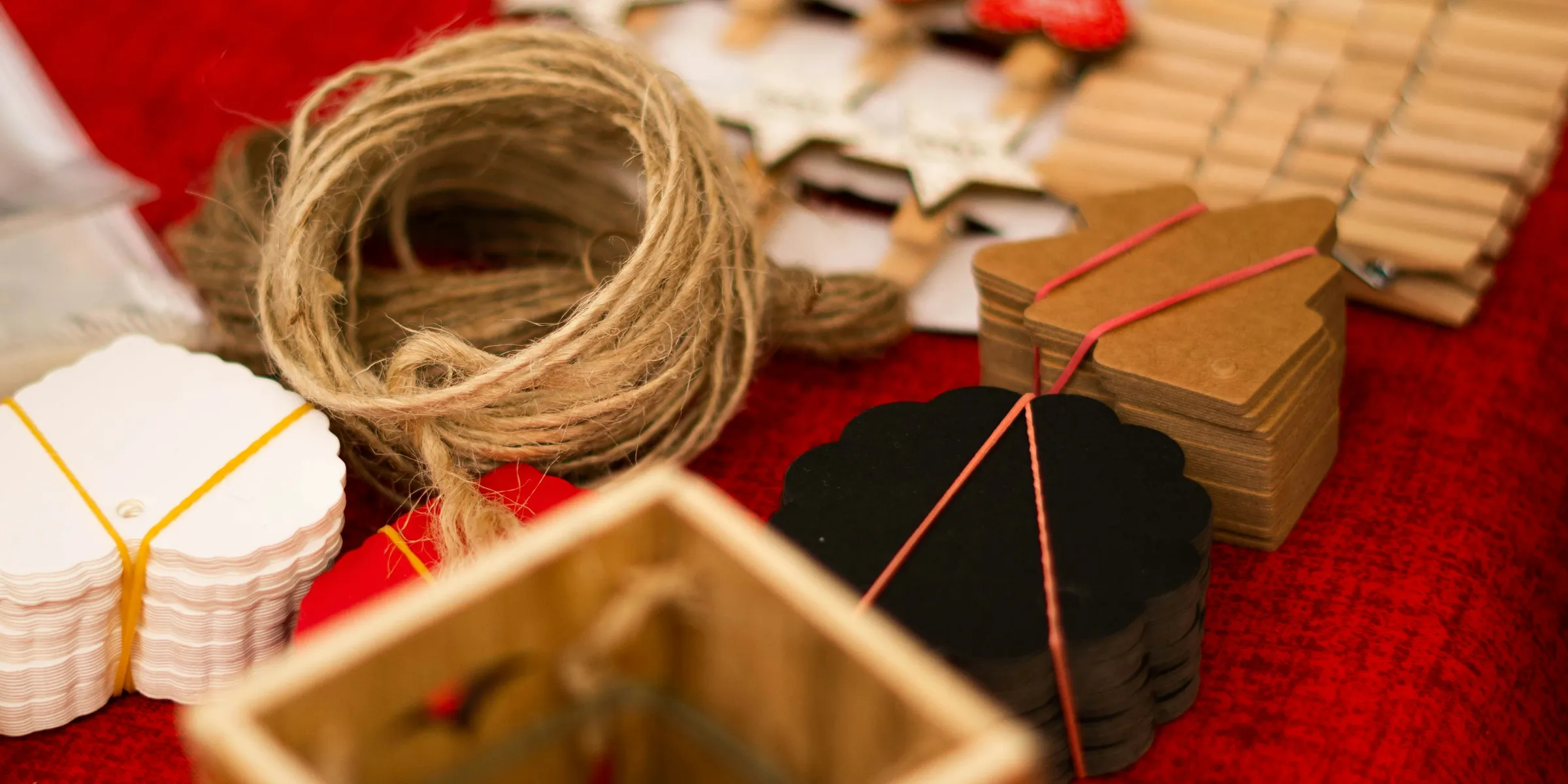 assorted art crafts on red textile