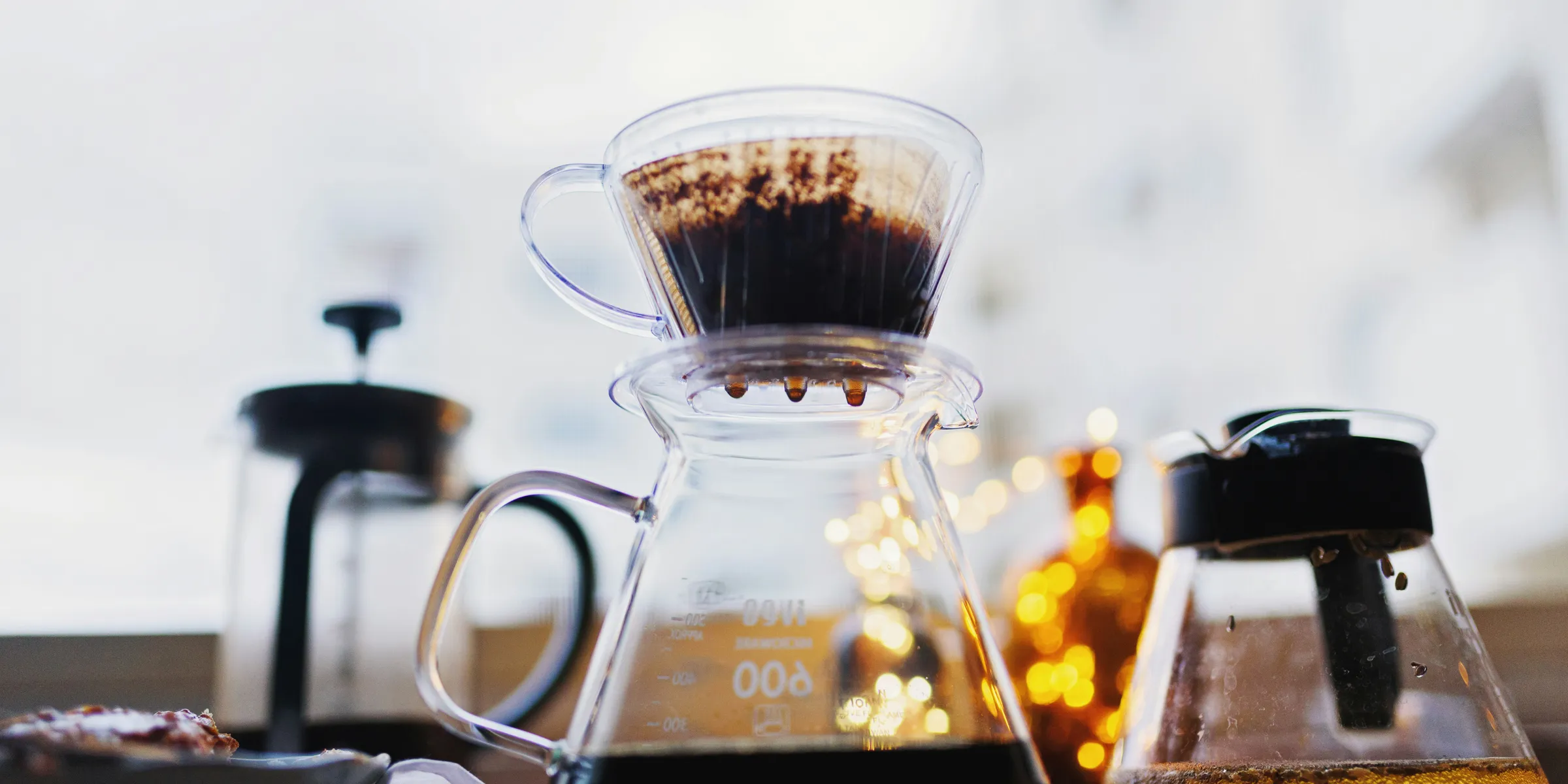 pure black coffee dripping on carafe at the table