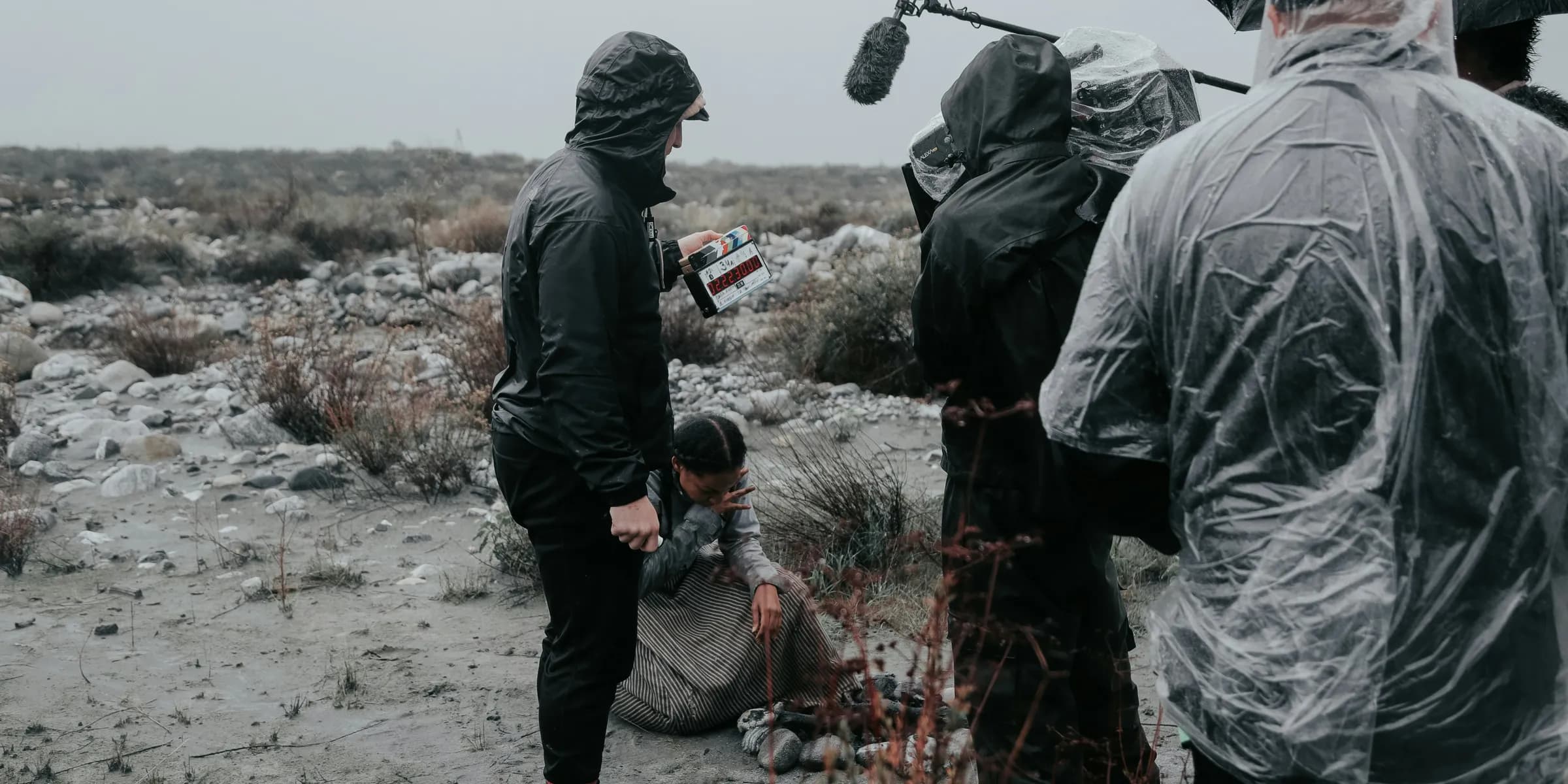 person standing beside person holding microphone during daytime