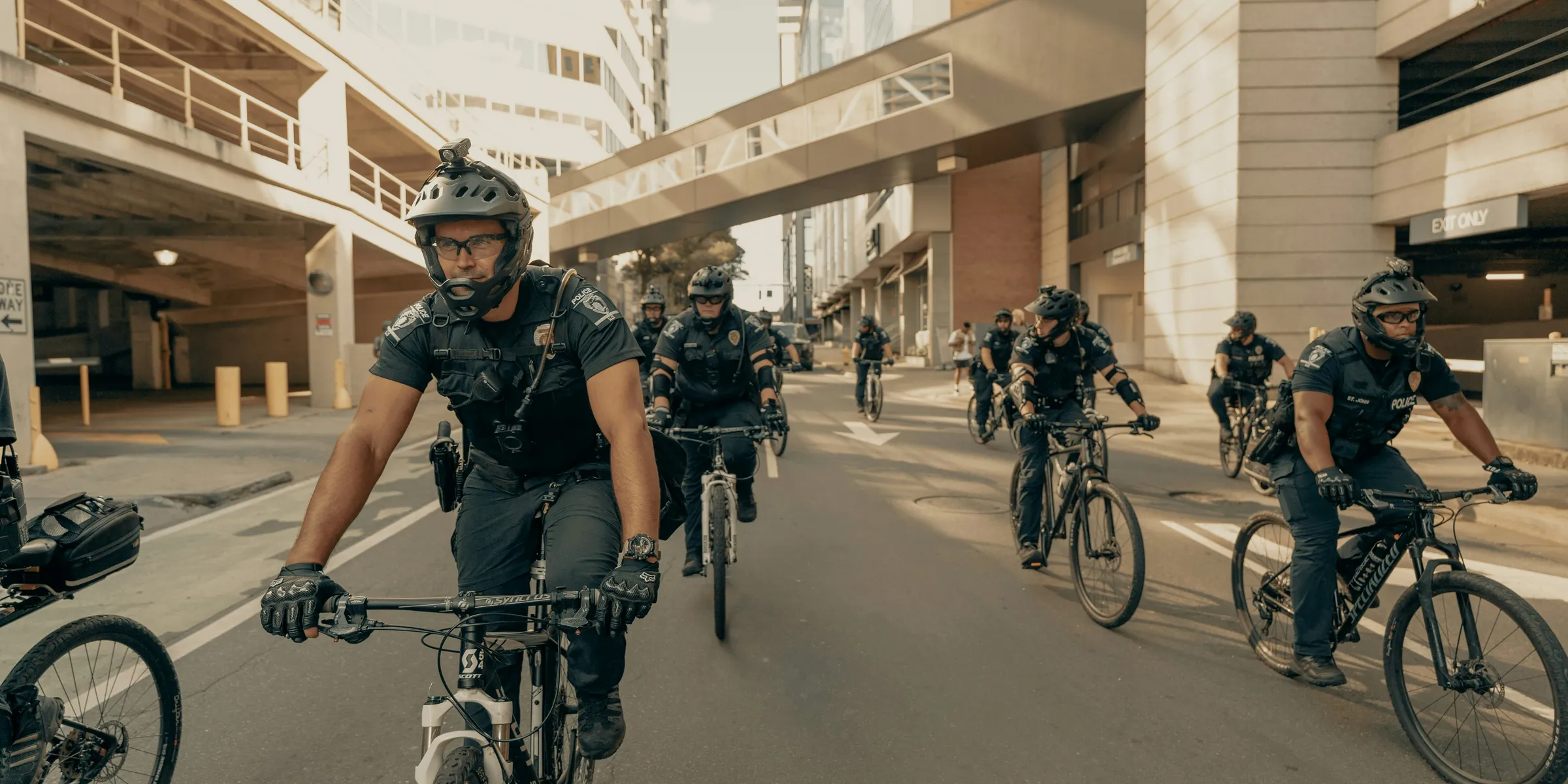 people riding bicycles on road during daytime