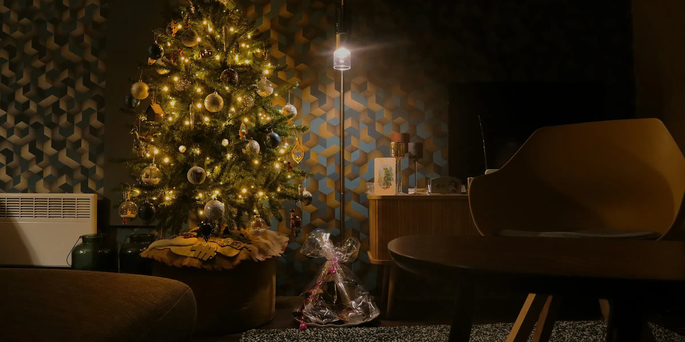 a living room with a christmas tree and a piano