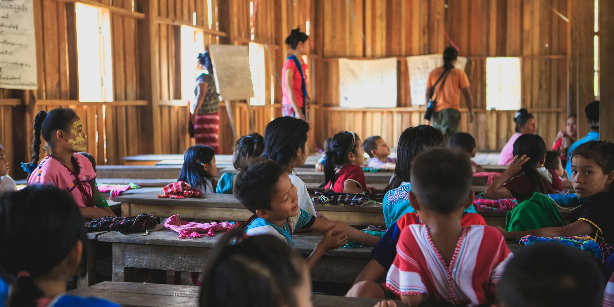 group of toddlers on the school with teacher teaching