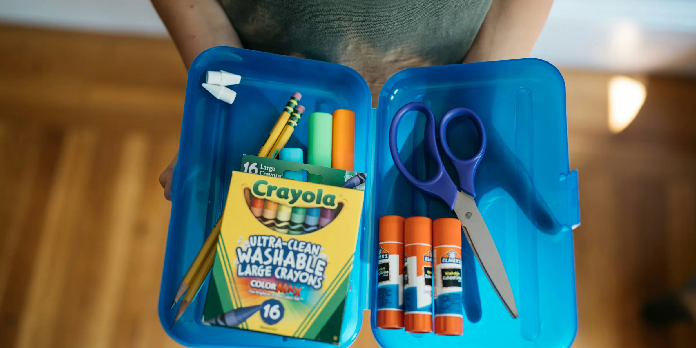 a bag of scissors and a package of scissors on a table
