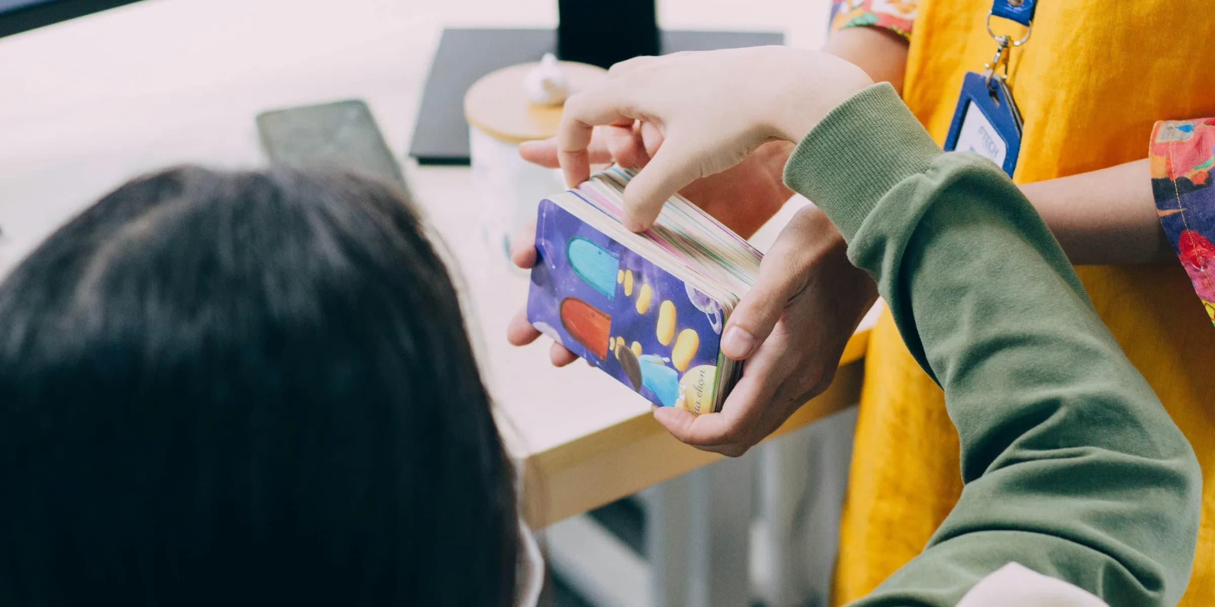 a person holding a box with a donut inside of it