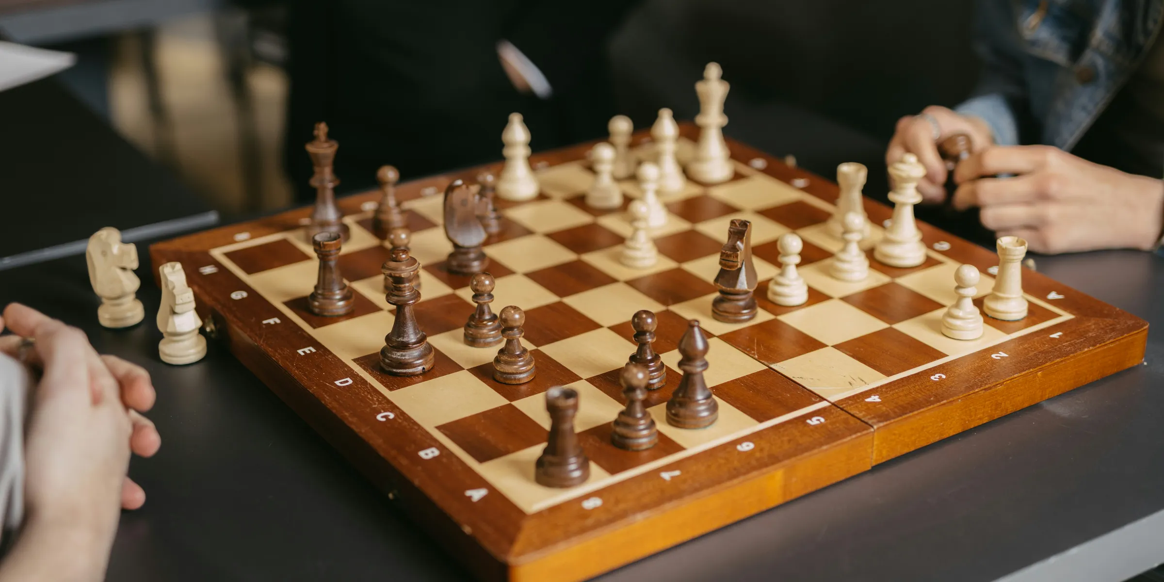 People are playing a game of chess together.