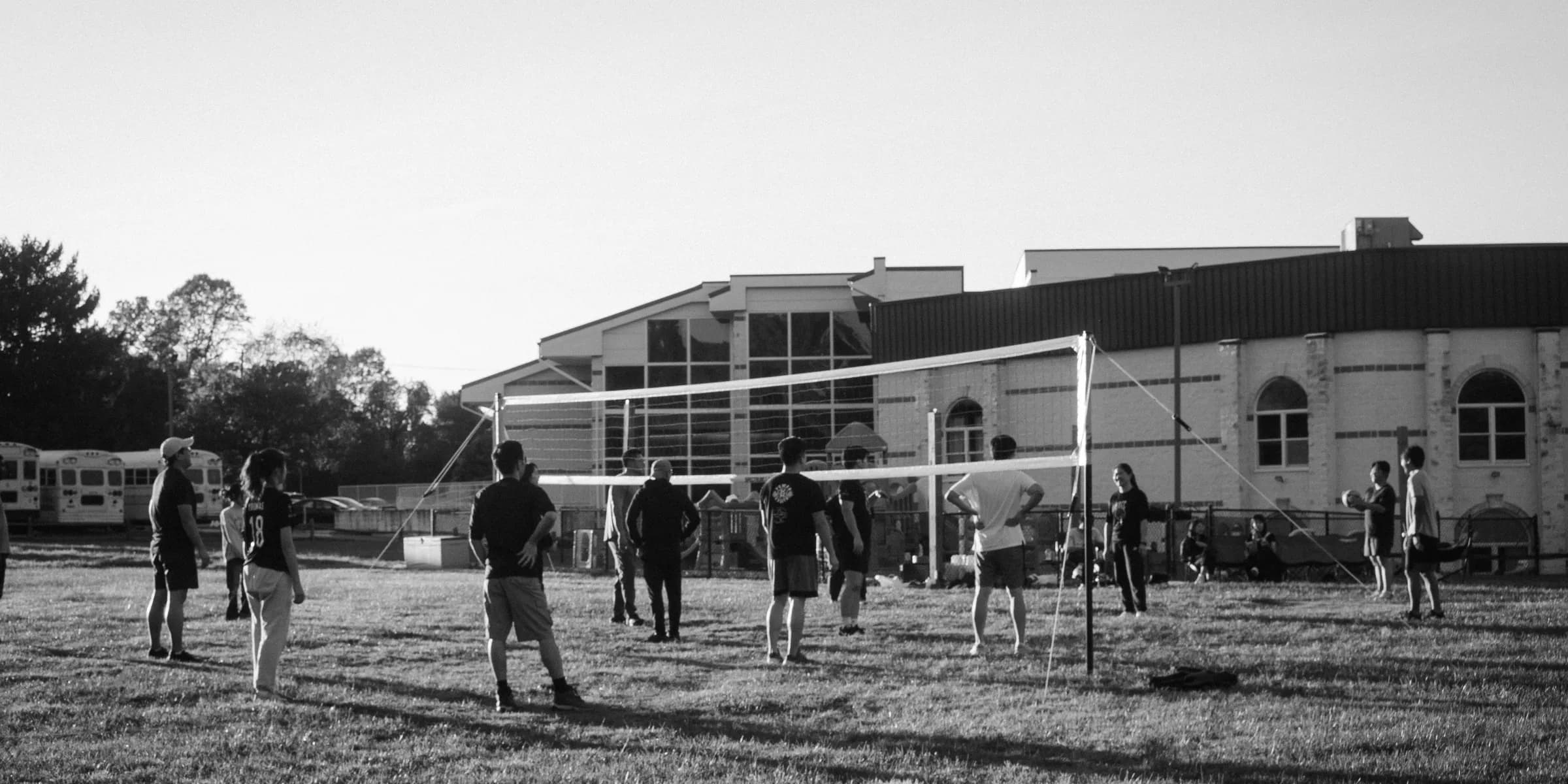 A group of people playing a game of volleyball
