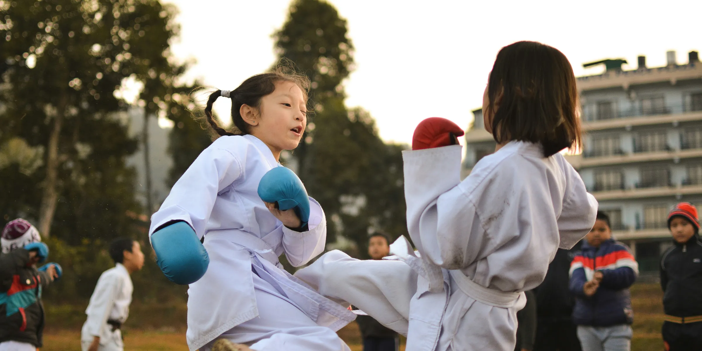 children participating in martial art sparring