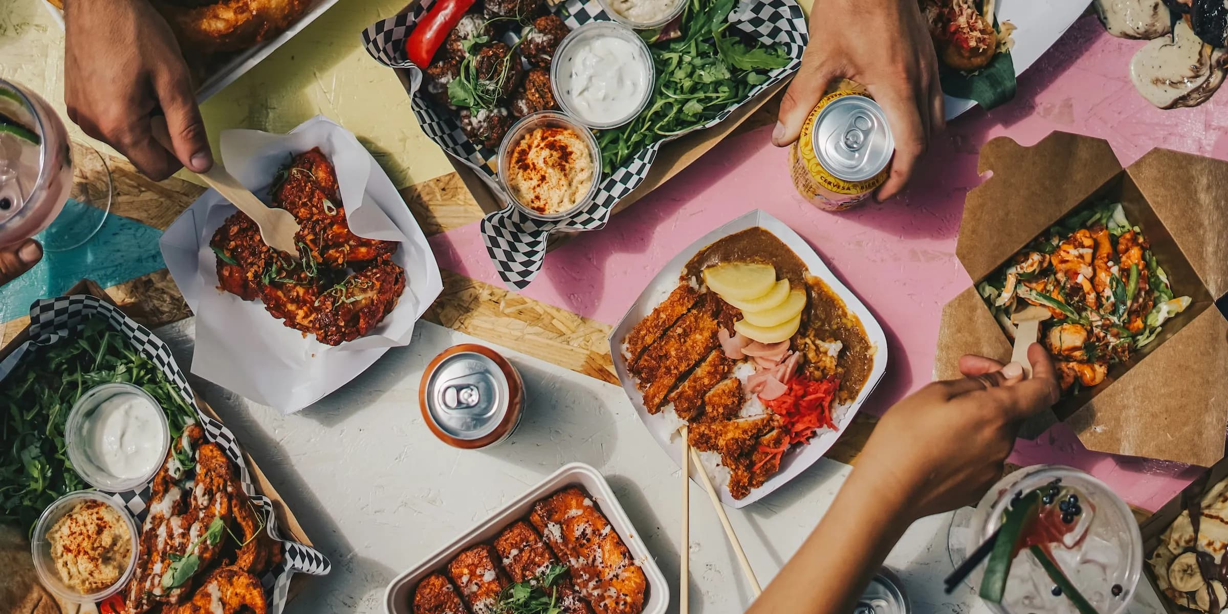 a person with an umbrella standing next to a car