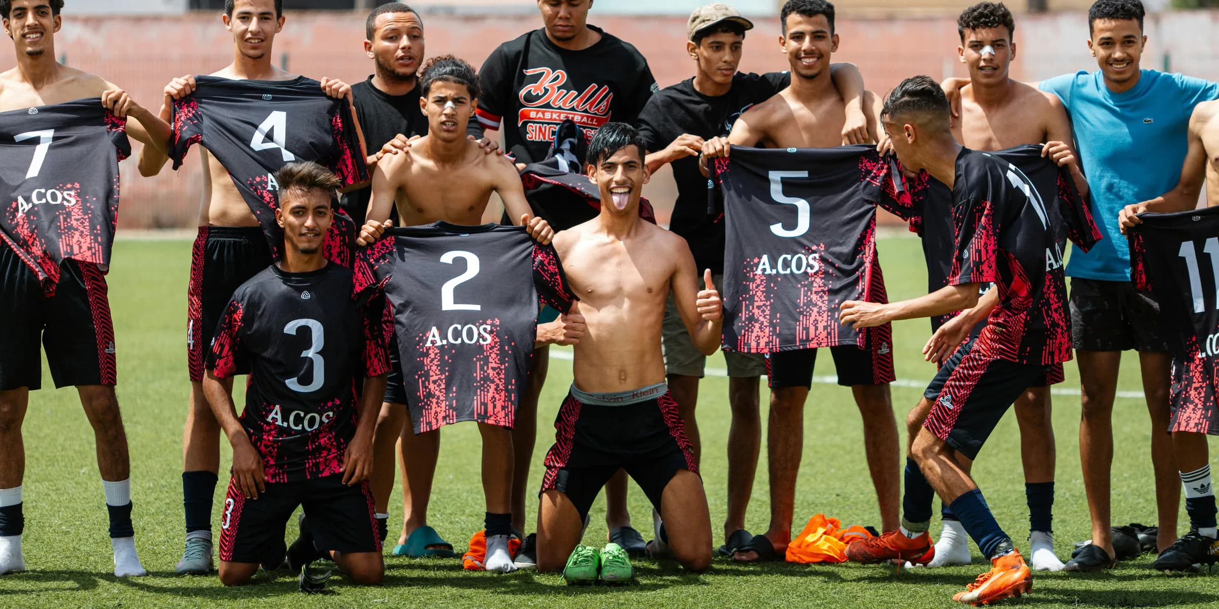 A soccer team poses for a group photo.