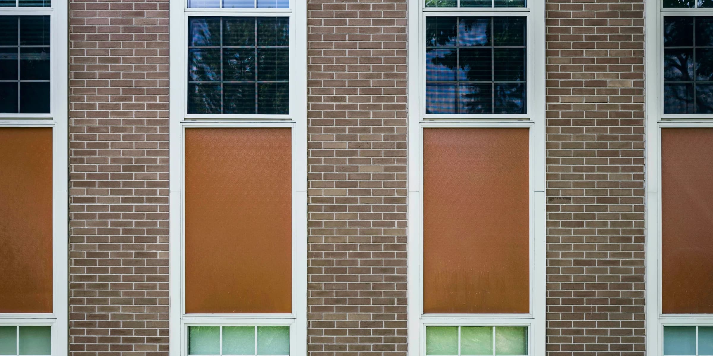 brown concrete building with closed windows
