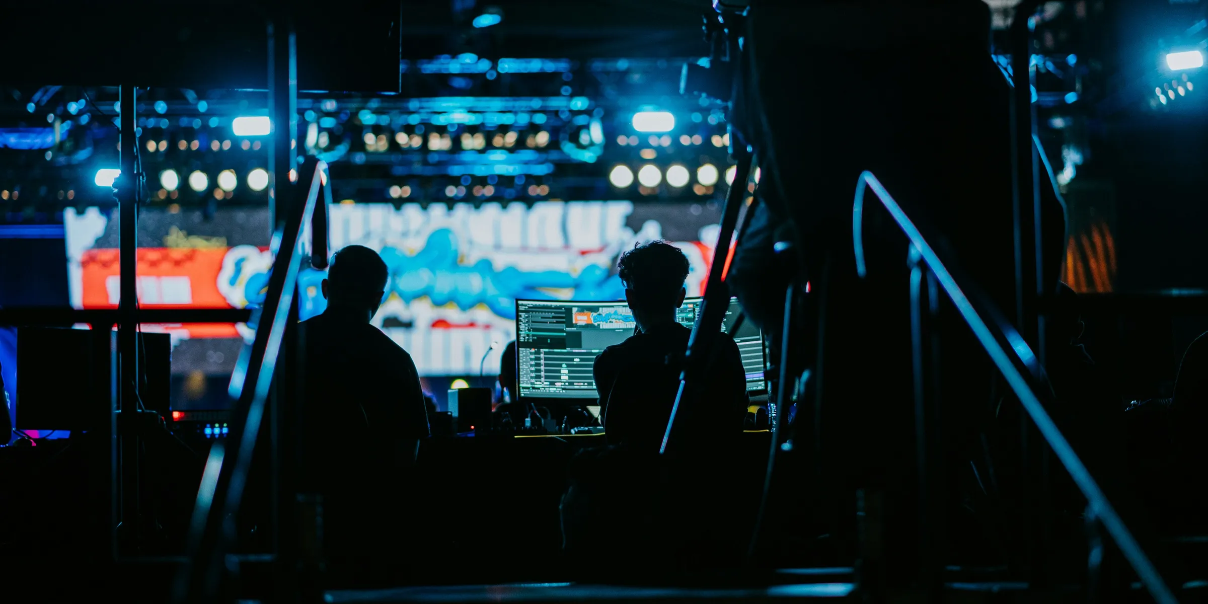 a couple of people that are sitting in front of a laptop