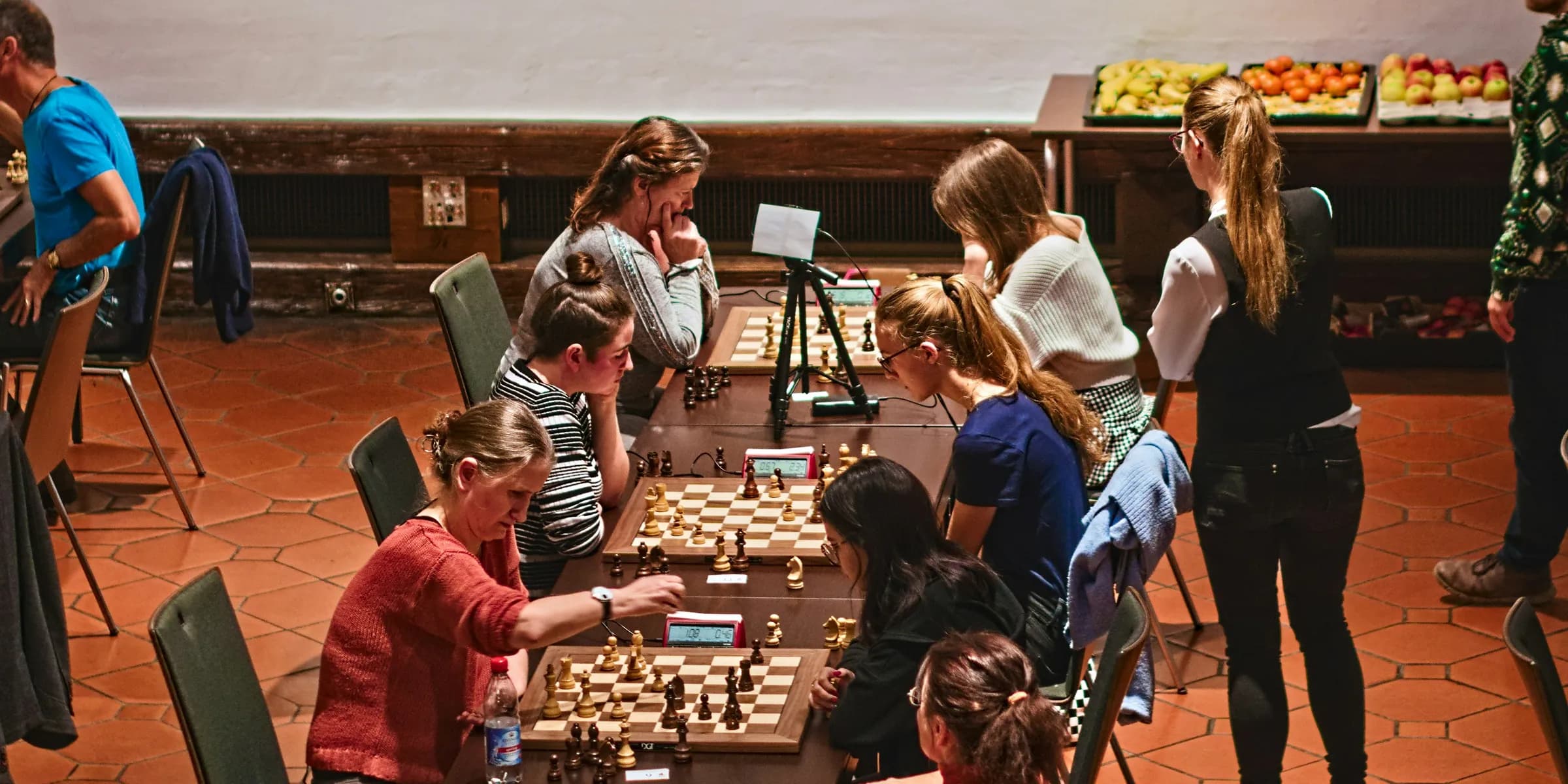 a group of people playing a game of chess
