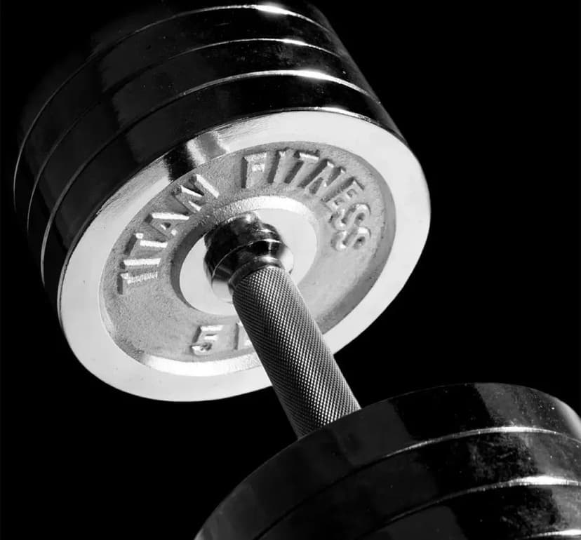 Weightlifting imagery featuring 200 LB Set Adjustable Chrome Dumbbells
