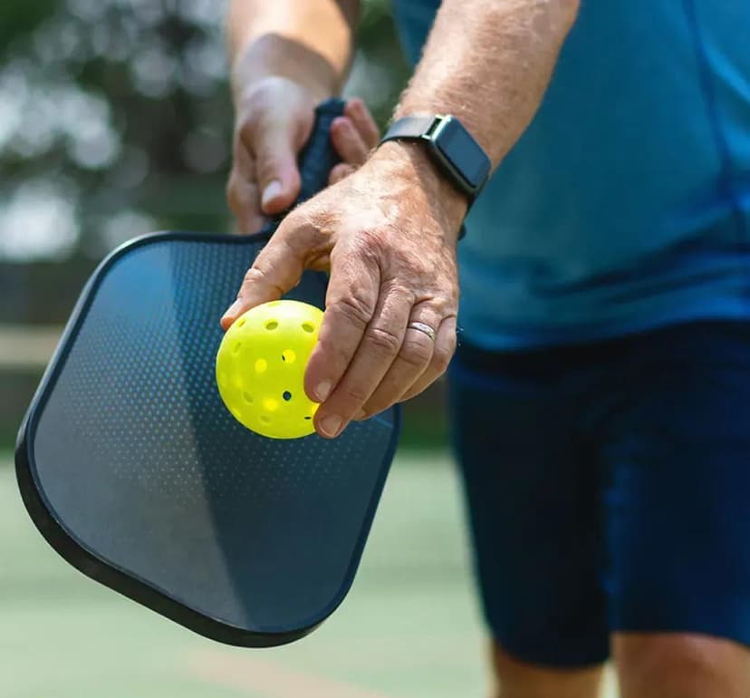 Pickleball imagery featuring Wilson Tru Outdoor Pickleballs
